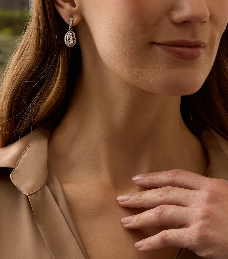 Boodles Motherhood diamond earrings in platinum and rose gold (British brand)
