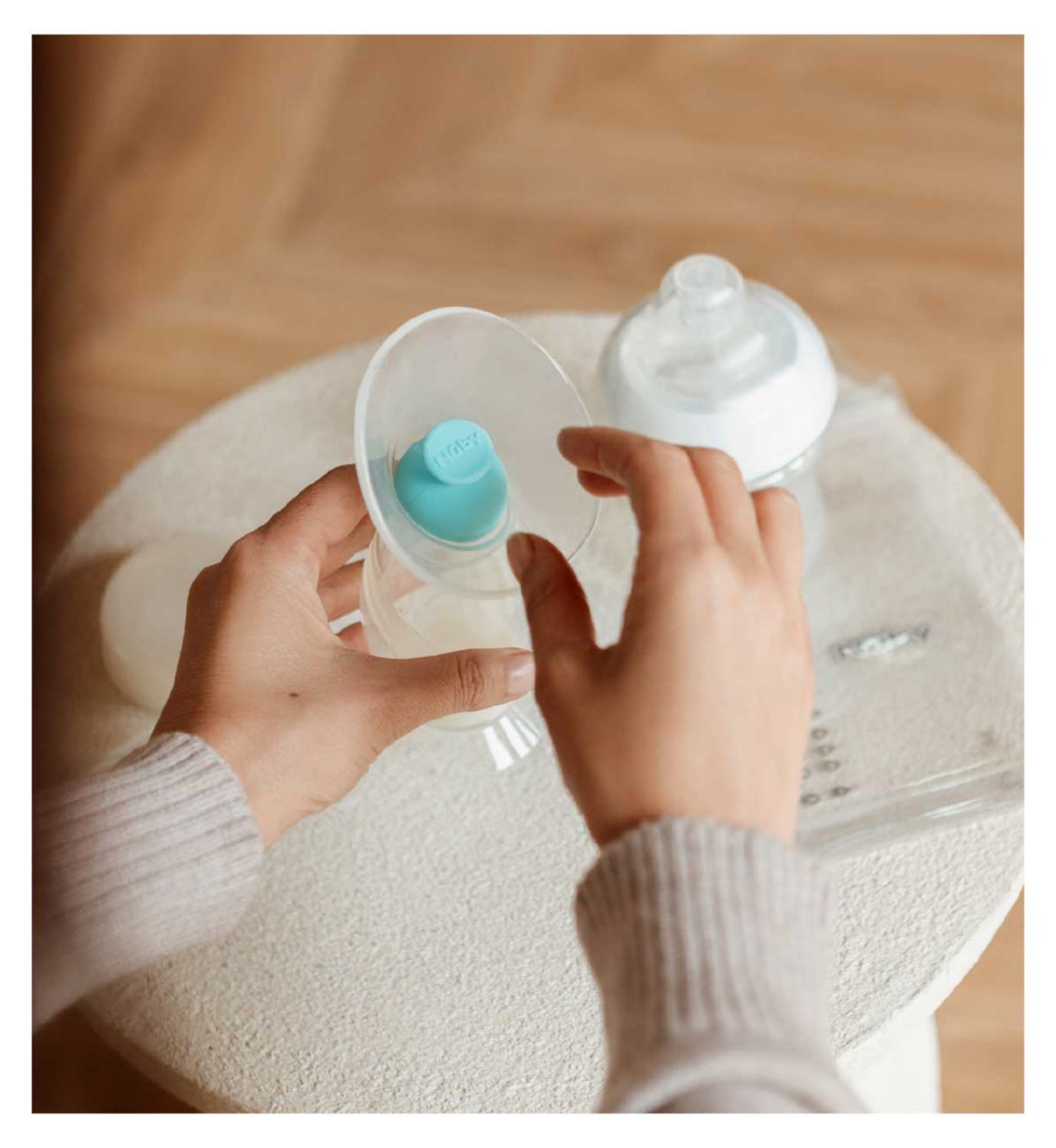 Nuby silicone breast pump with 180ml bottle and accessories, imported from the UK