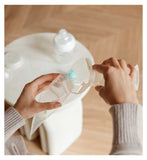 Nuby silicone breast pump with 180ml bottle and accessories, imported from the UK