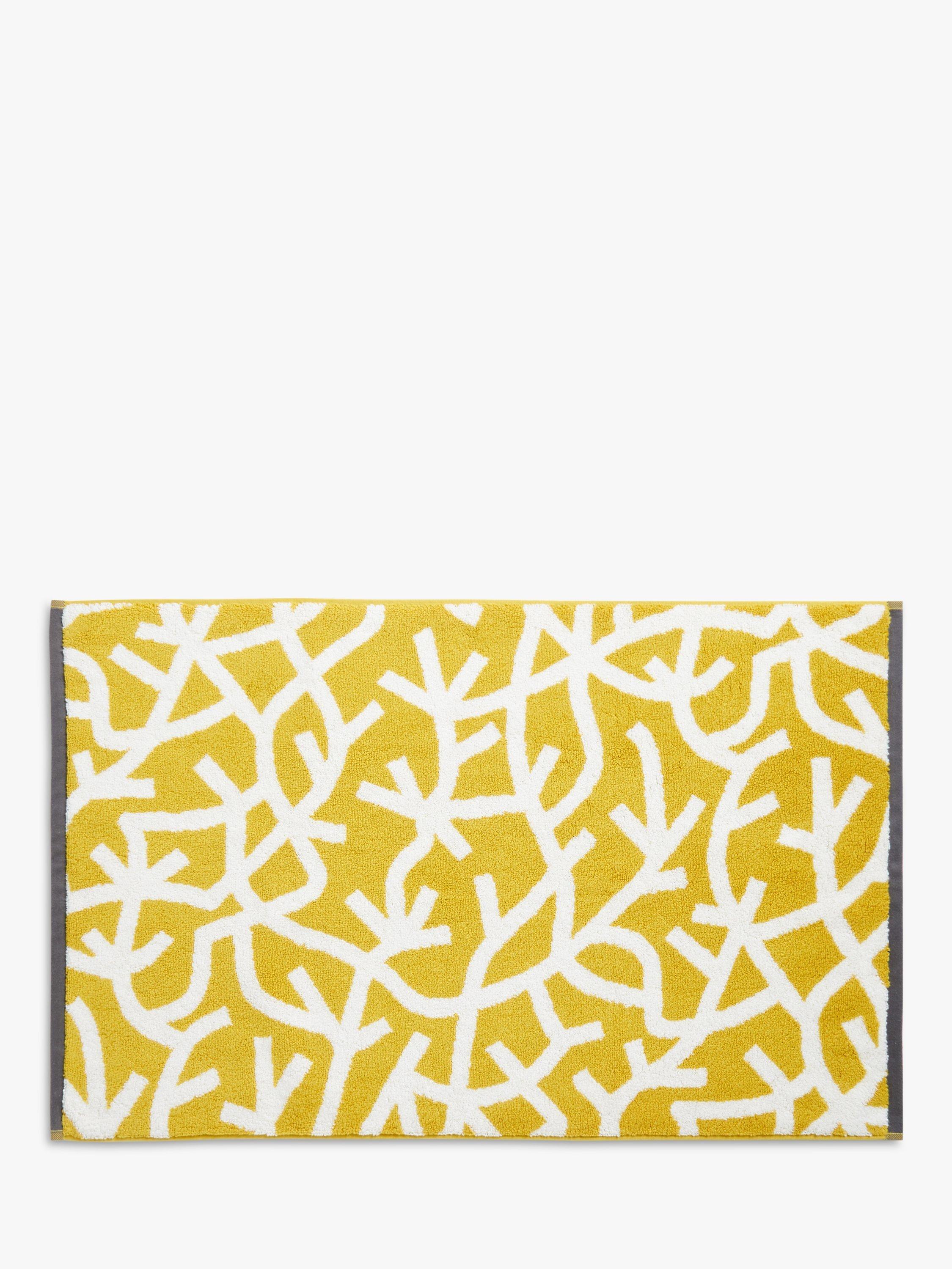 Mini Moderns cotton bath mat with forest graphic print in mustard, imported from the UK