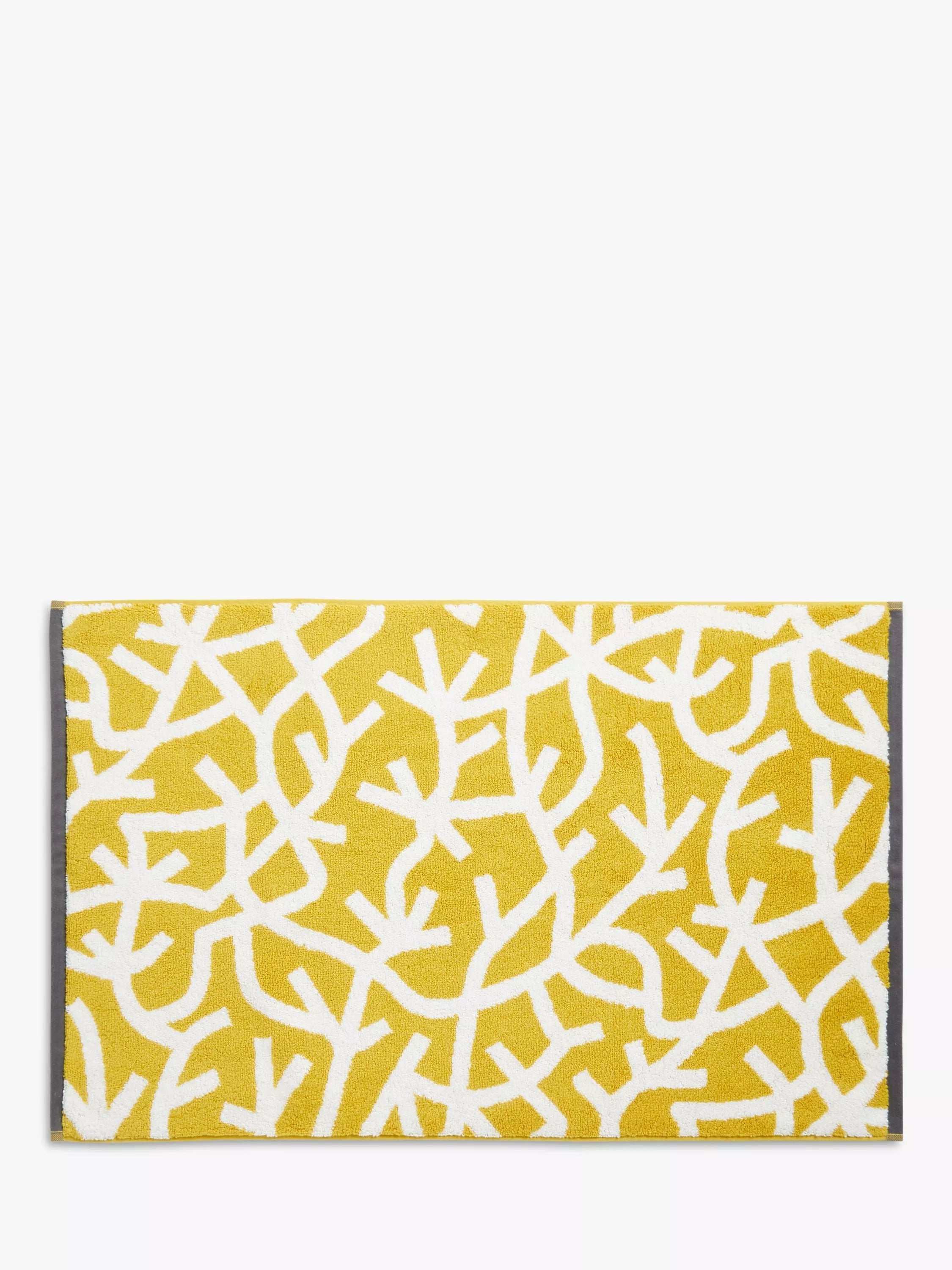 Mini Moderns cotton bath mat with forest graphic print in mustard, imported from the UK