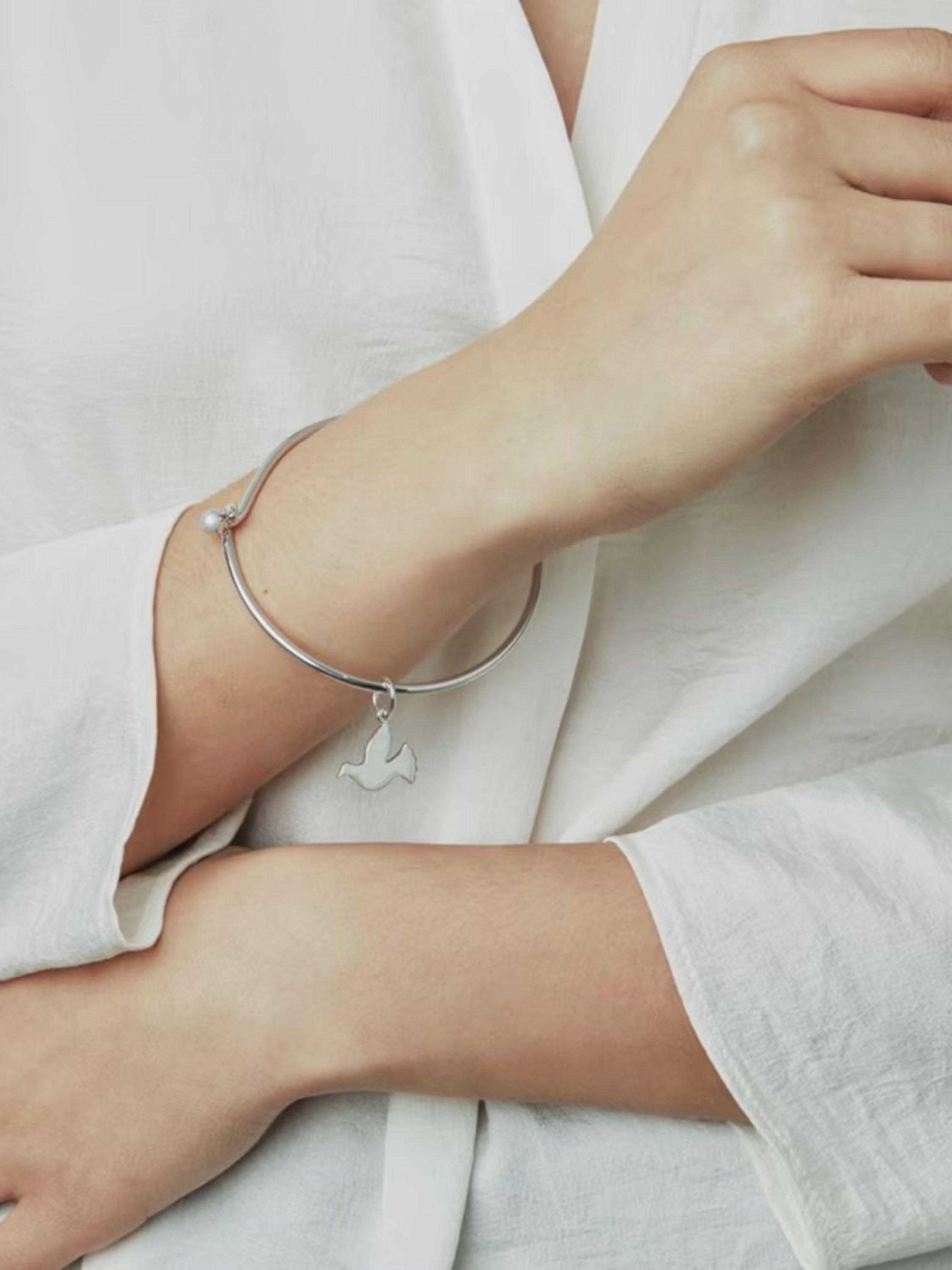 Recognised sterling silver dove bangle, imported from the UK