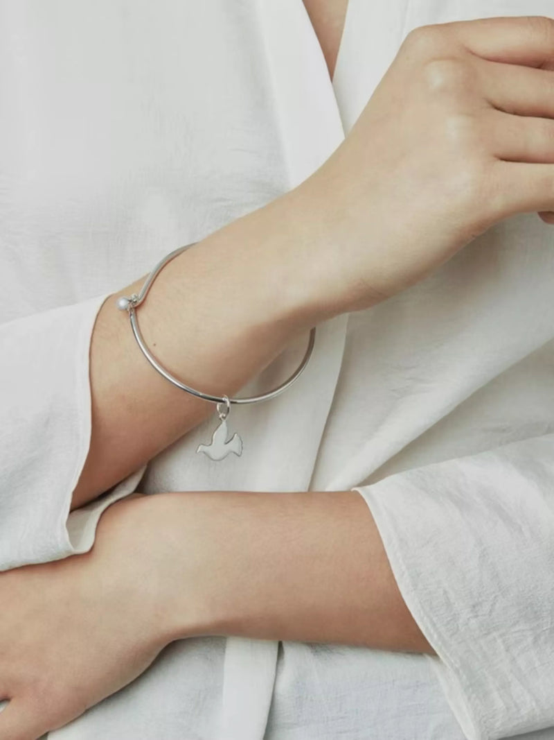 Recognised sterling silver dove bangle, imported from the UK
