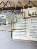 Nkuku Kiko glazed portrait frame in antique brass - British product