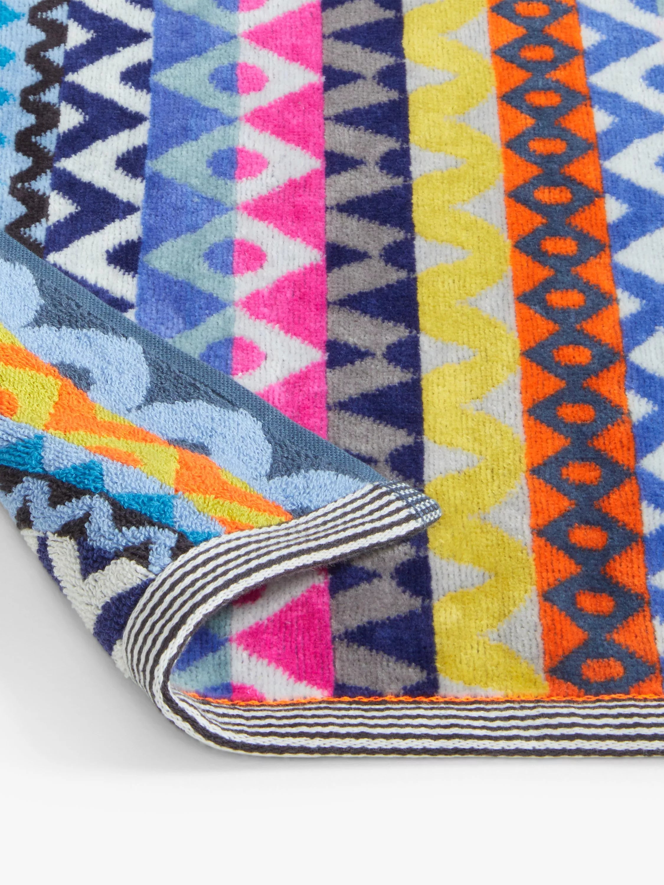 Margo Selby beach towel with red multi geometric pattern, imported from the UK