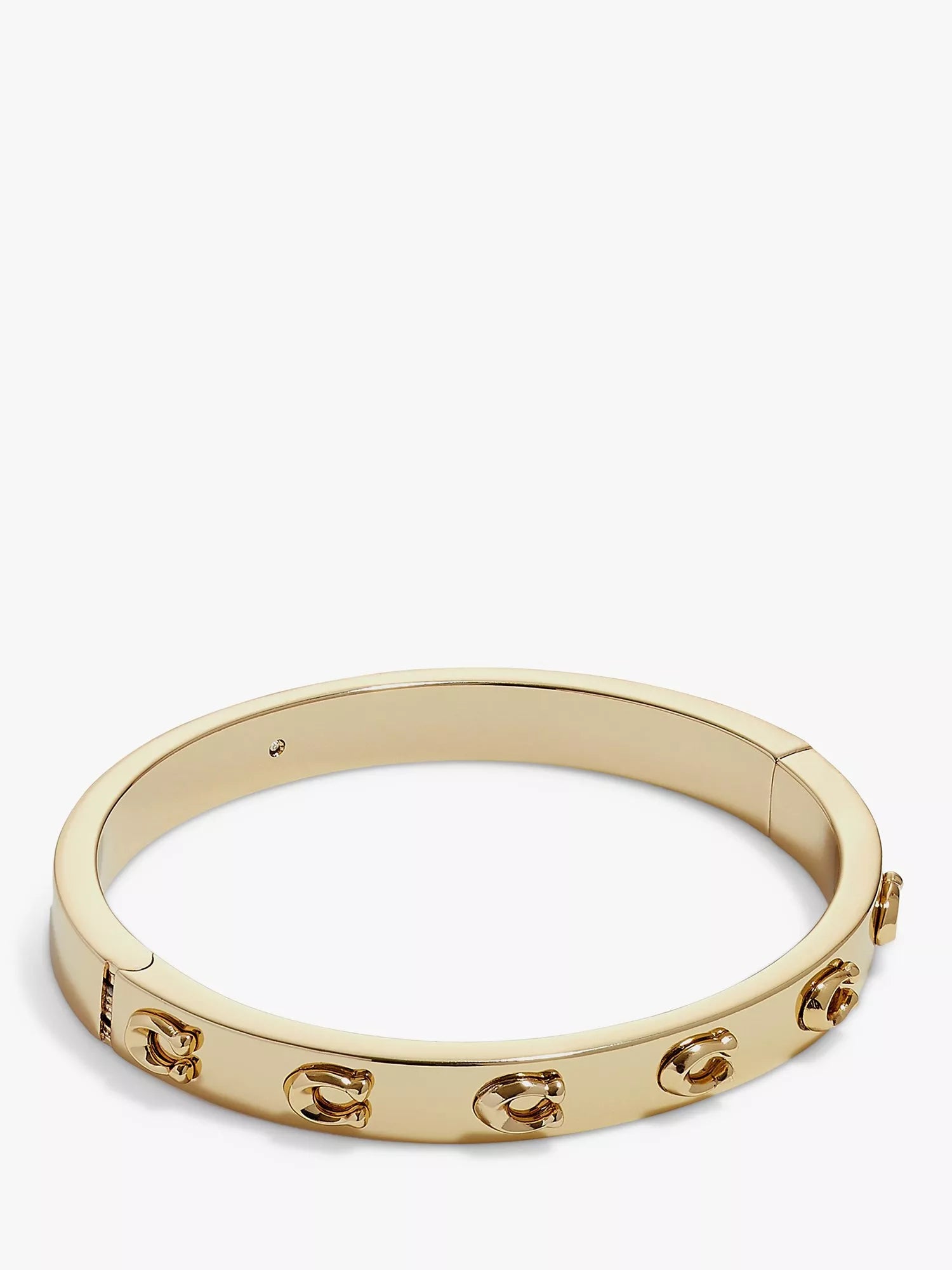 Coach C motif bangle gold toned brass, imported from the UK