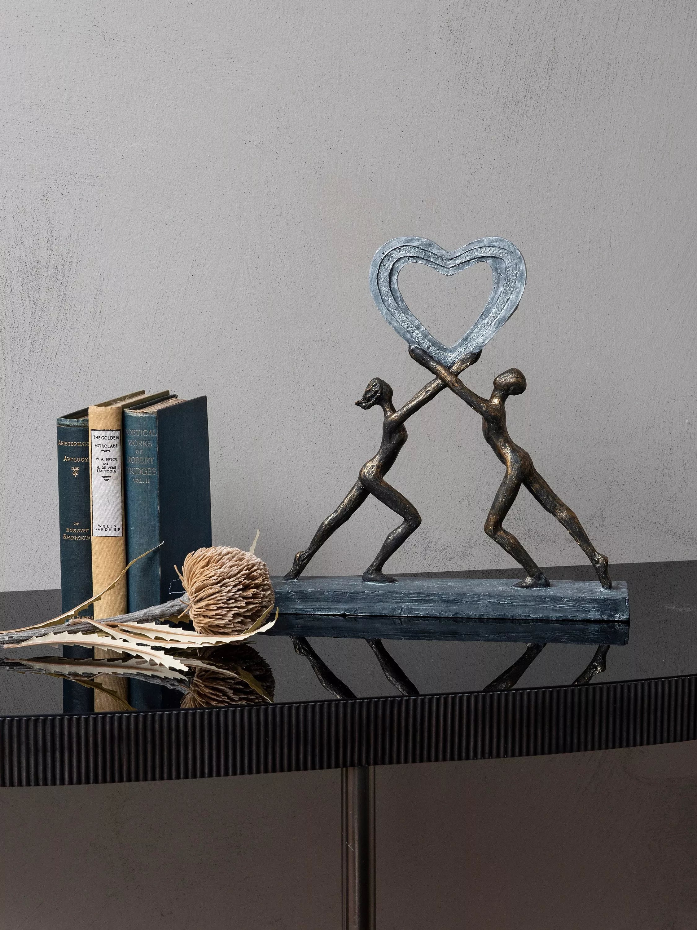 Libra Interiors love couple resin sculpture metallic bronze, imported from the UK