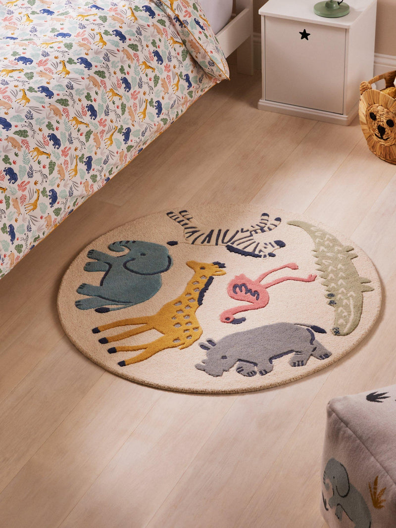 Safari-themed round wool rug with 100cm diameter, UK version