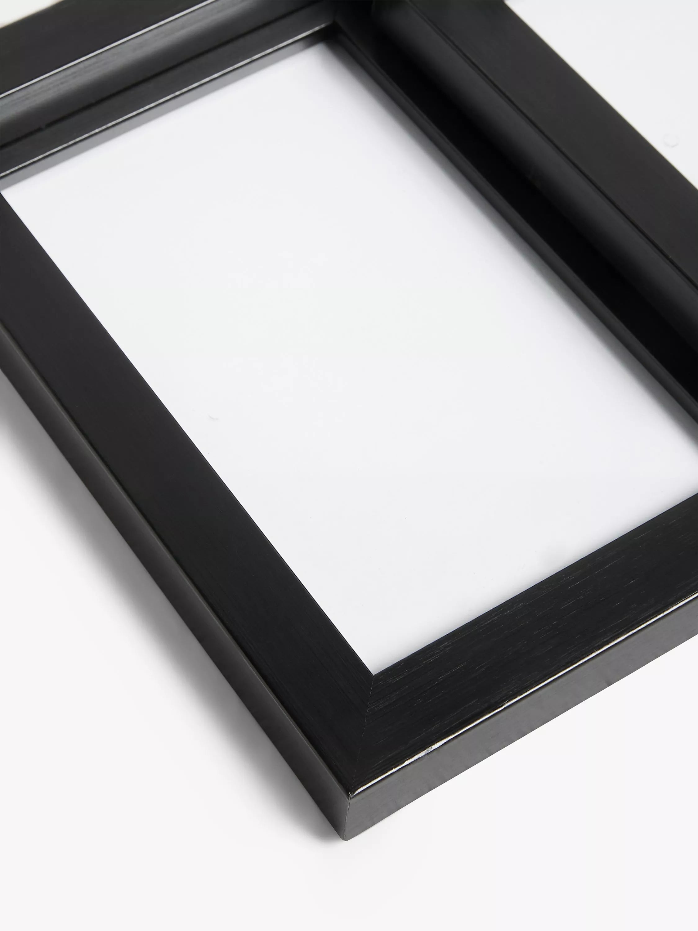 John Lewis 9-photo frame in black, imported from the UK