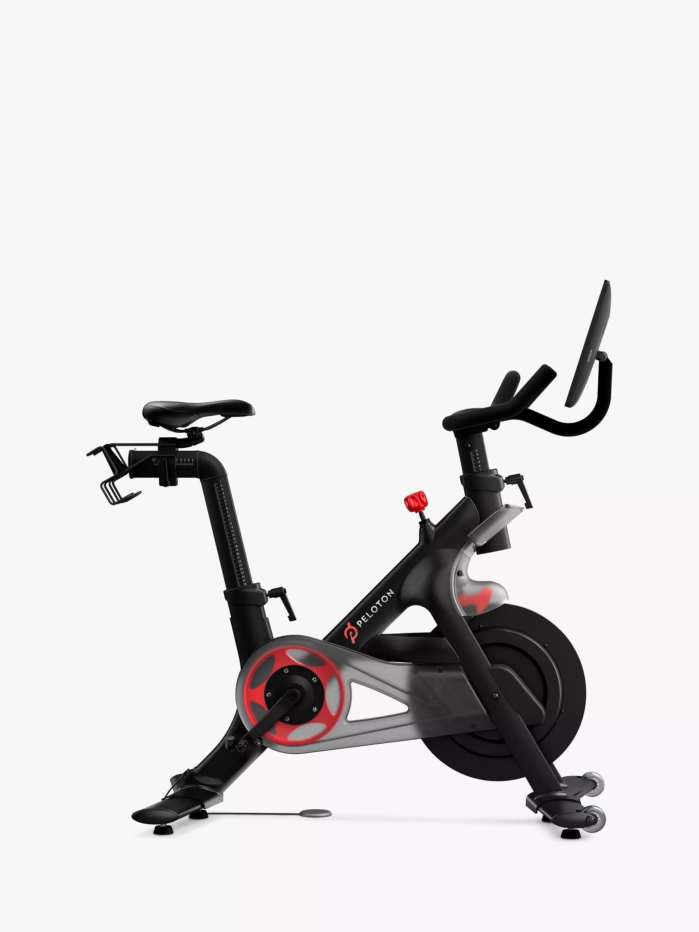 Peloton indoor exercise bike with 22-inch touchscreen, imported from the UK