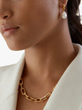 Monica Vinader baroque pearl huggie earrings in gold, imported from the UK