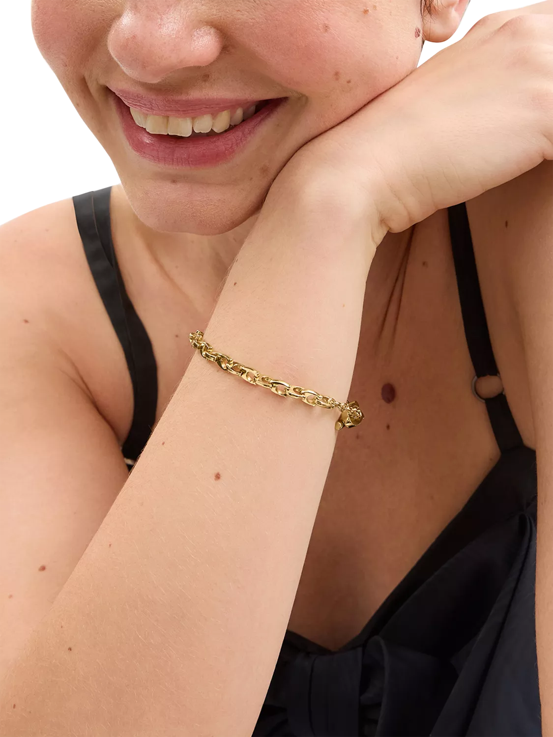 Coach gold chain bracelet with C-link design, UK version