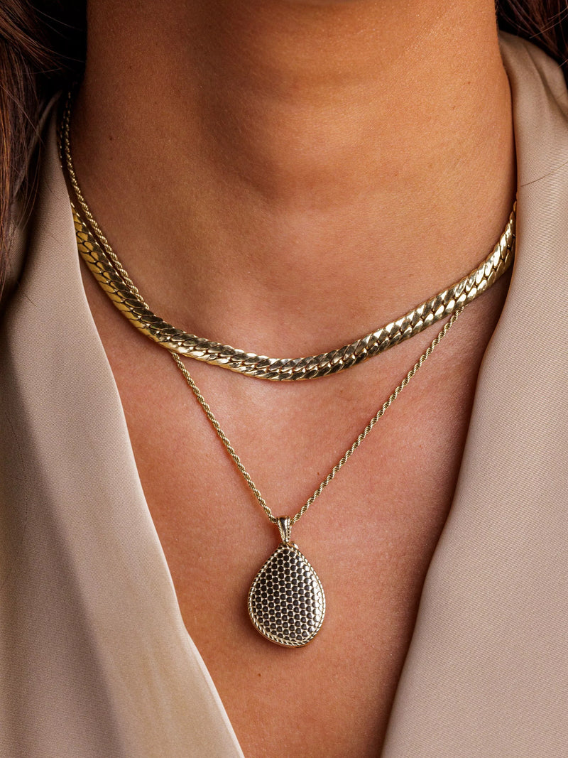 LARNAUTI gold pebble locket necklace, imported from the UK