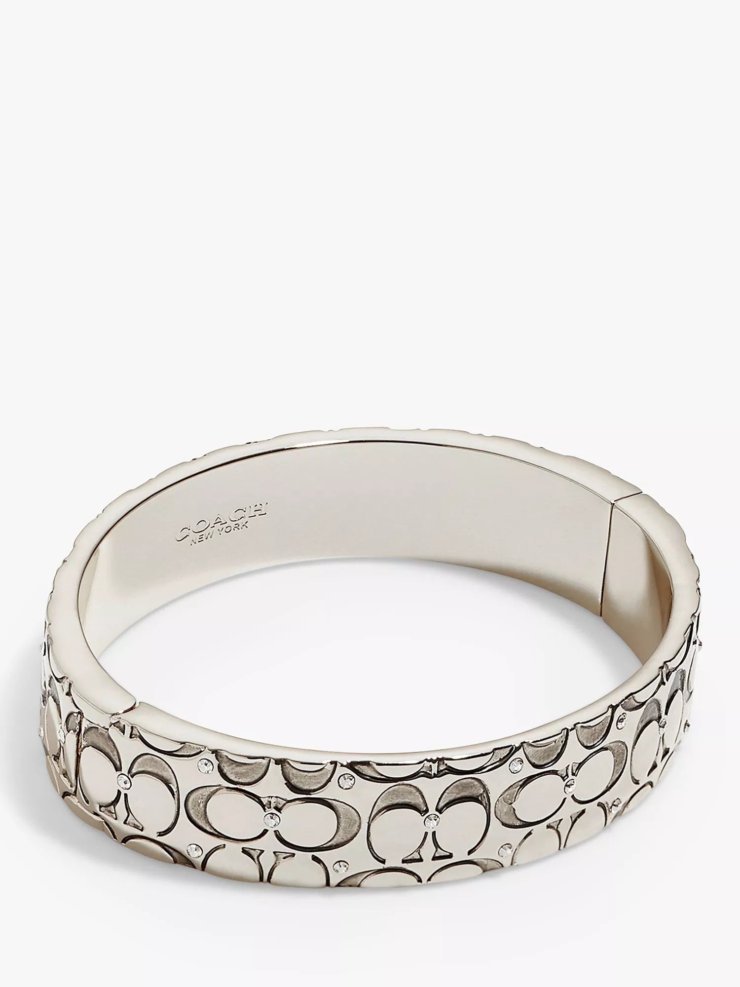 Coach silver crystal bangle with hinged closure, imported from the UK