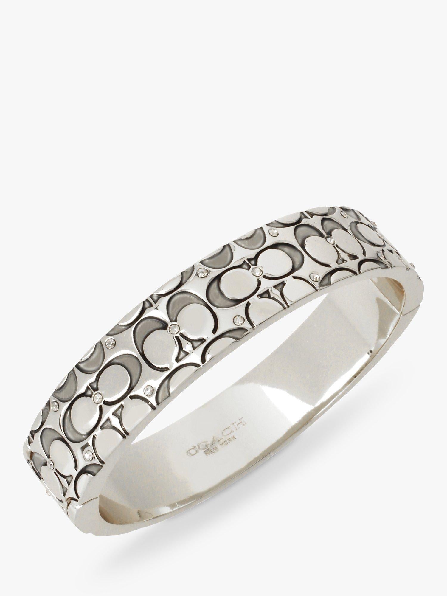 Coach silver crystal bangle with hinged closure, imported from the UK