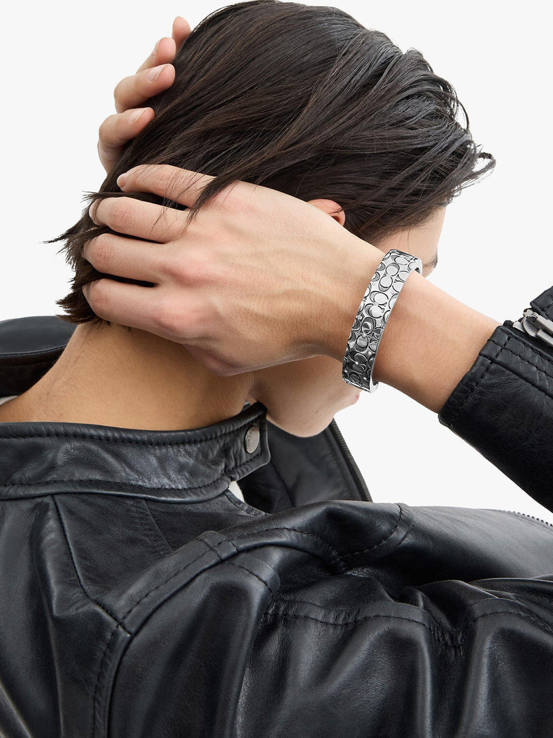 Coach silver crystal bangle with hinged closure, imported from the UK
