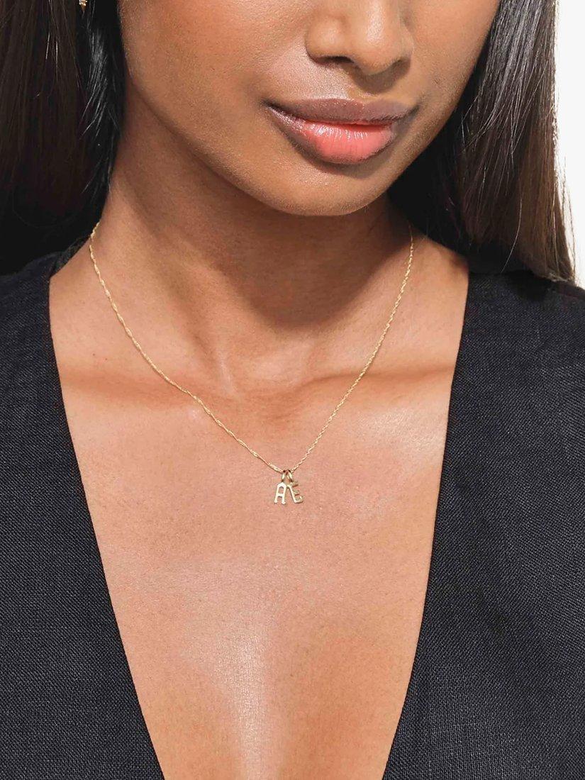 Edge of Ember 14ct gold initial pendant imported from the UK