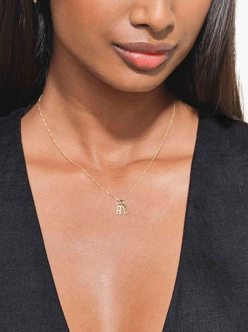 Edge of Ember 14ct gold initial pendant imported from the UK