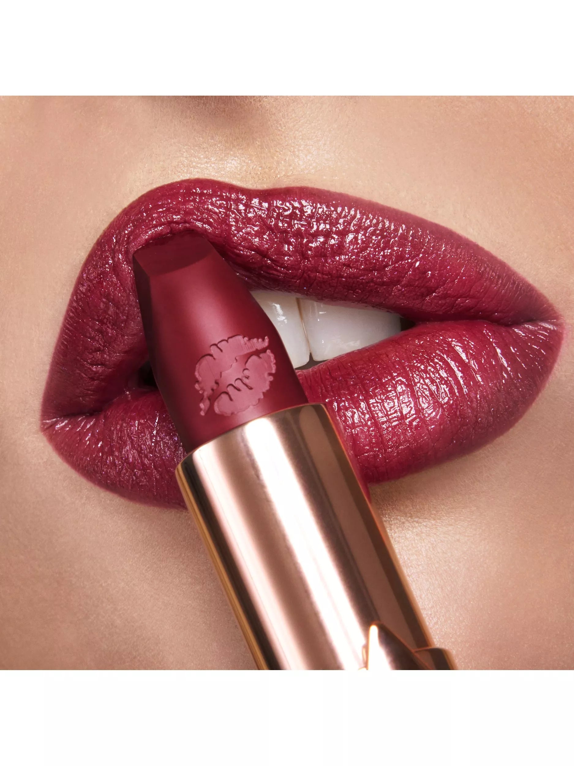 Charlotte Tilbury deep berry-red lipstick in Ready For Lust shade - British product