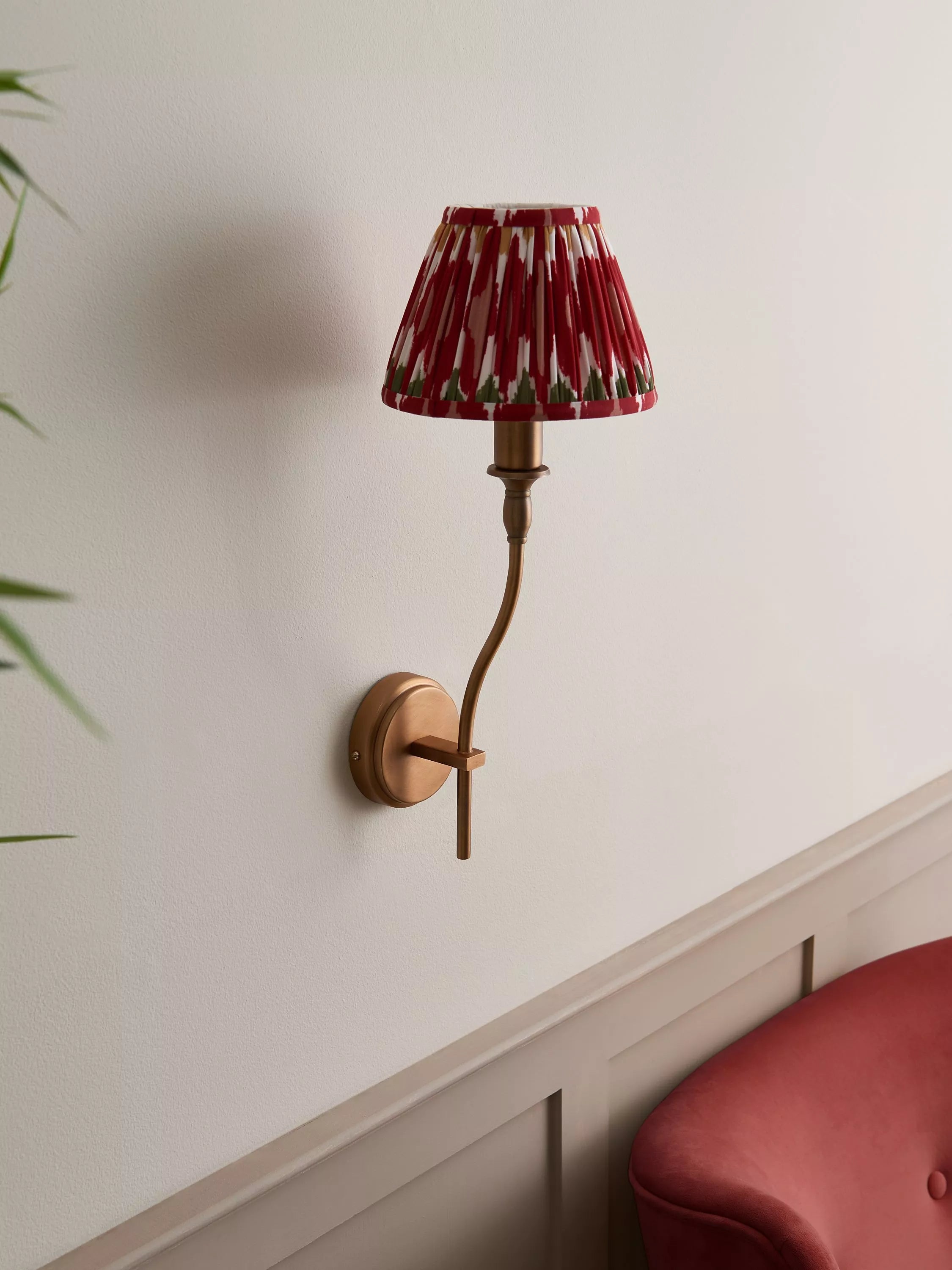 John Lewis Elk wall light fitting in matt antique brass, imported from the UK
