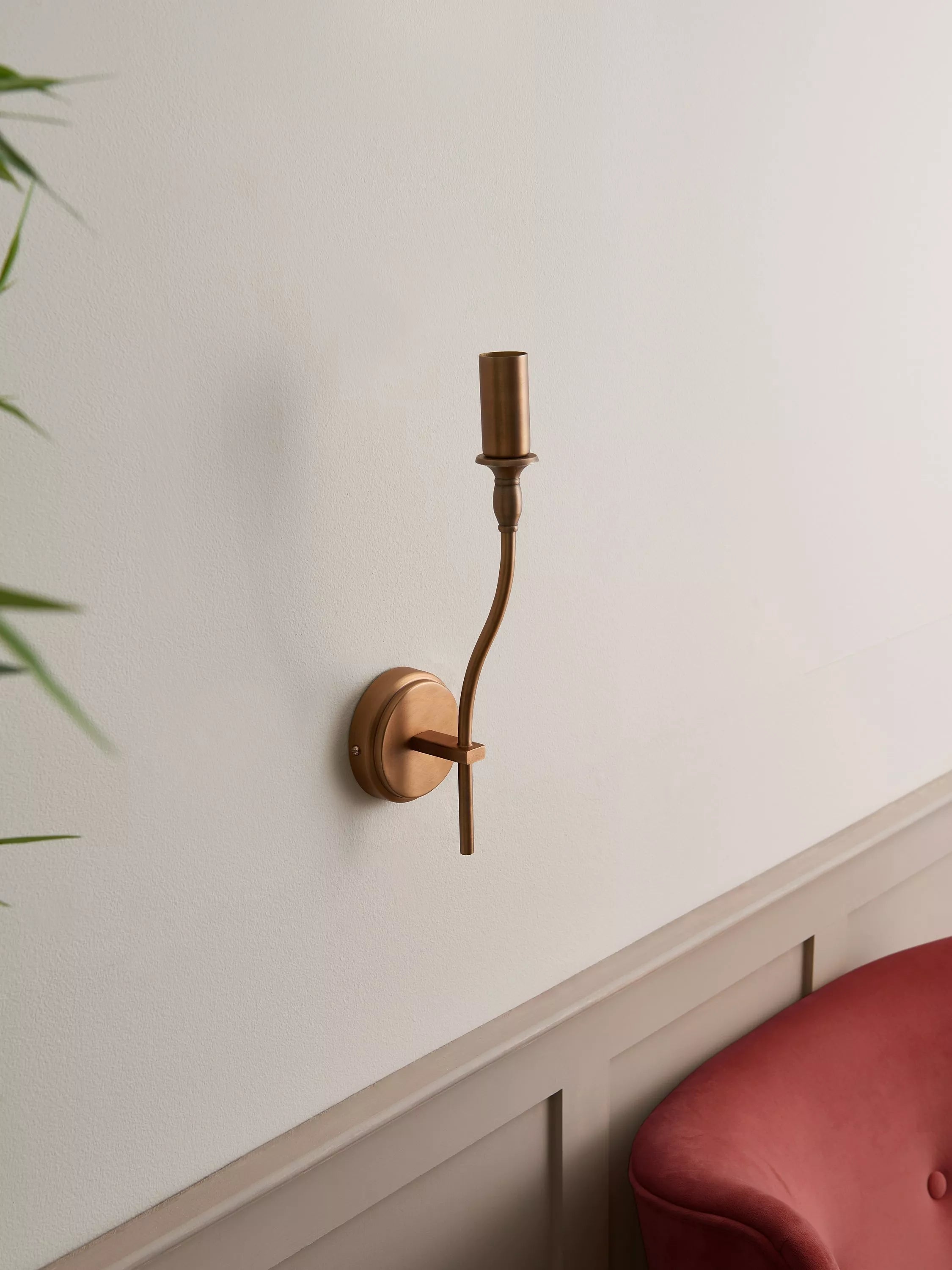 John Lewis Elk wall light fitting in matt antique brass, imported from the UK