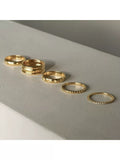 Daisy London gold ring with star engraving (British brand)