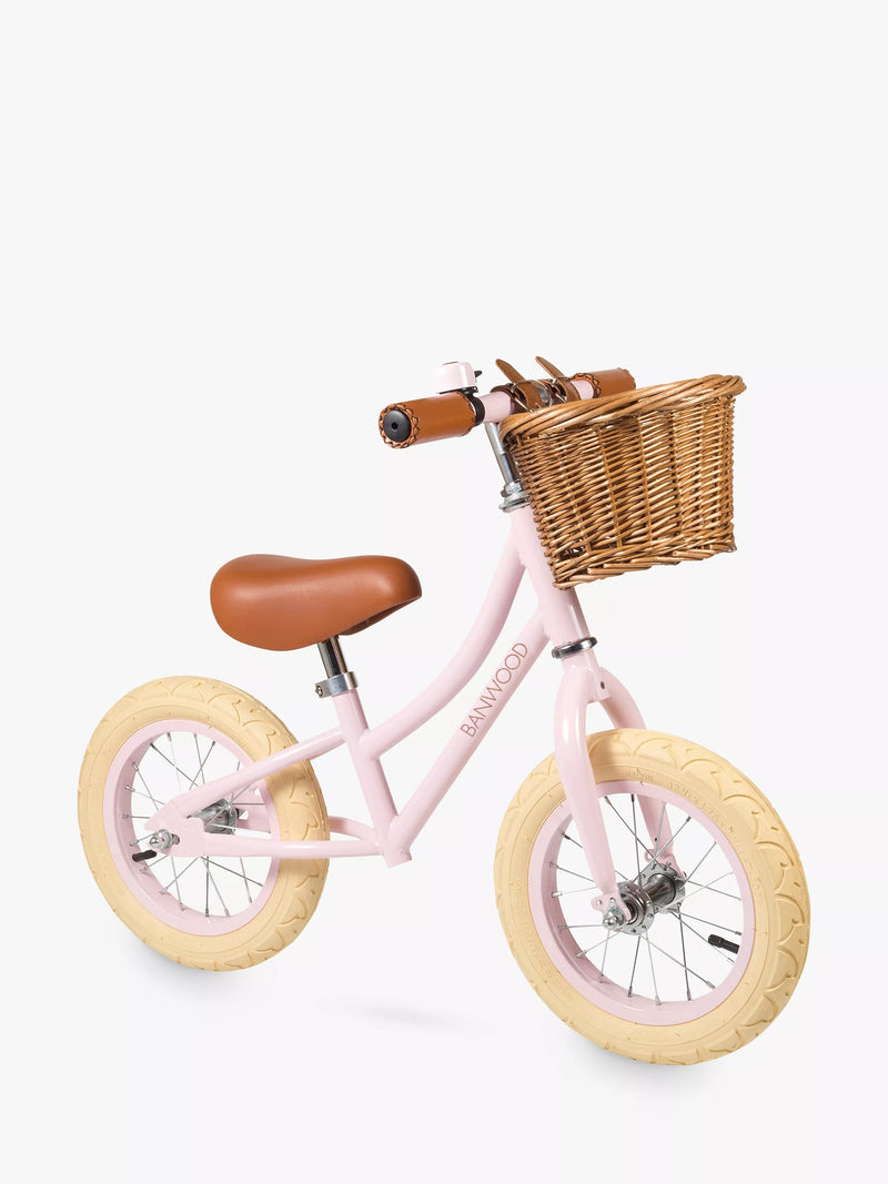 Banwood balance bike with wicker basket and bell, imported from the UK
