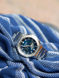 Casio G-SHOCK Herrenuhr blaues Zifferblatt Metallarmband, UK-Version