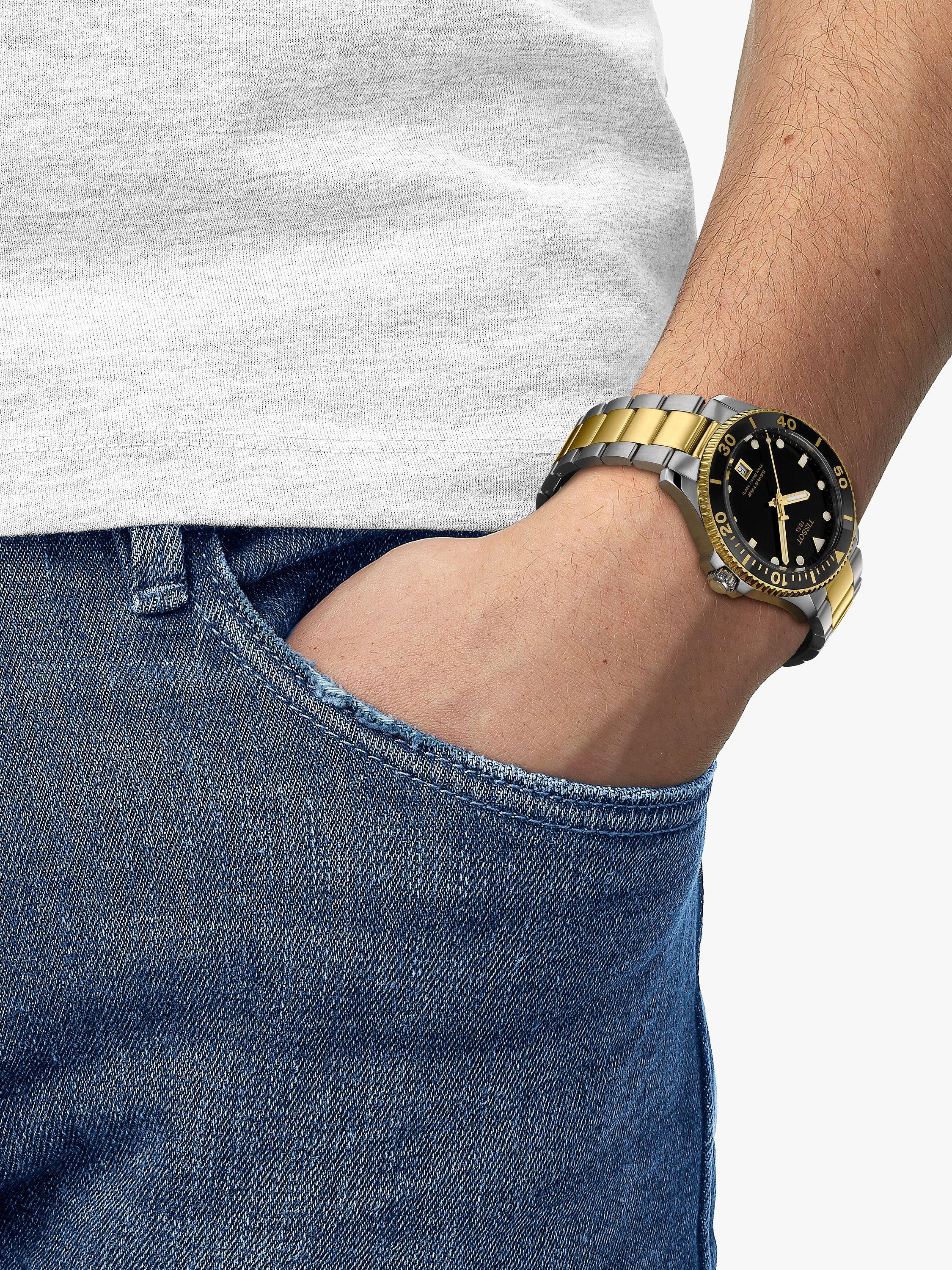 Tissot Seastar 1000 Quartz watch black dial gold-accented bezel (British brand)
