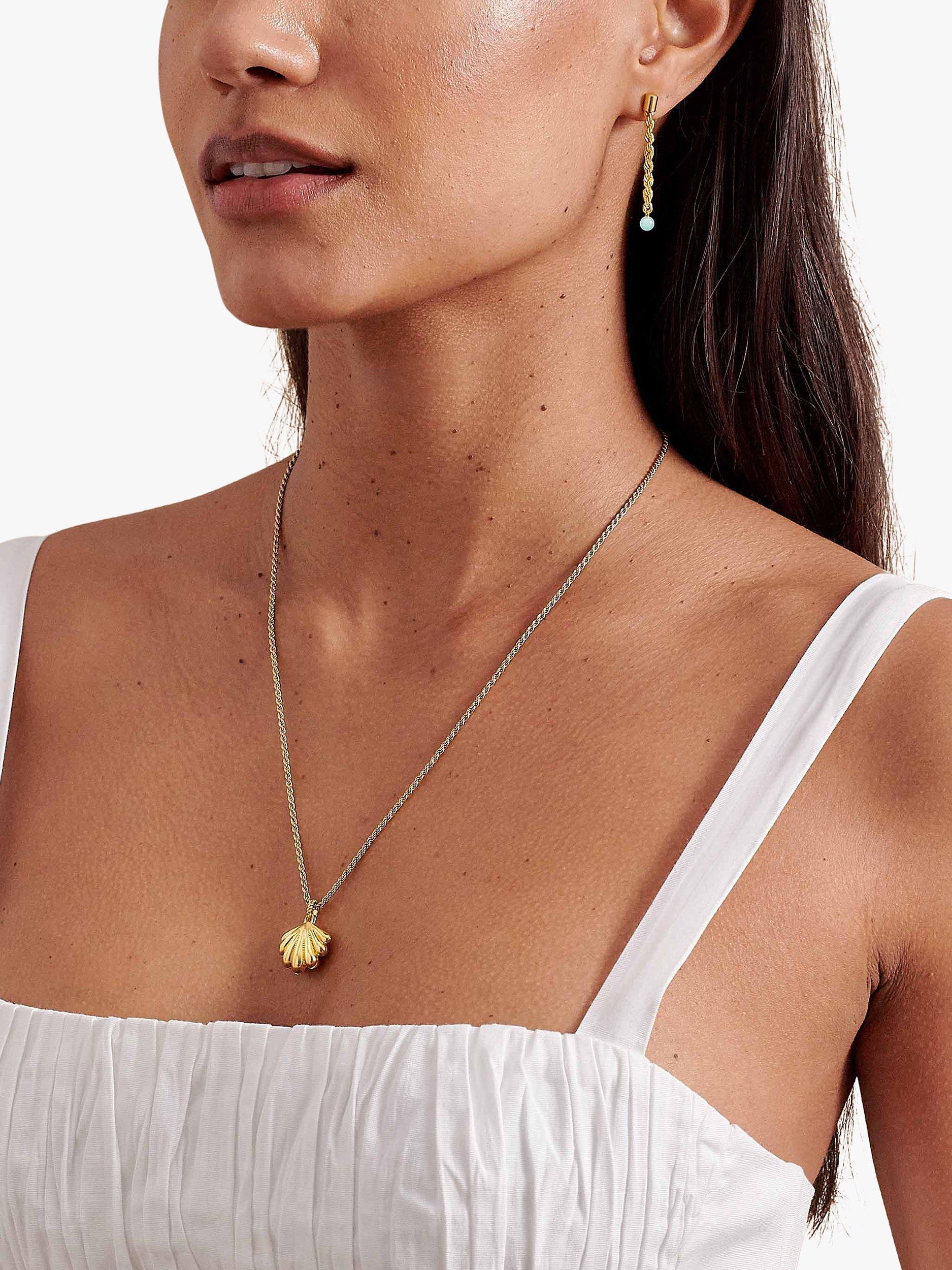 Edge of Ember gold shell locket necklace with rope chain, UK version