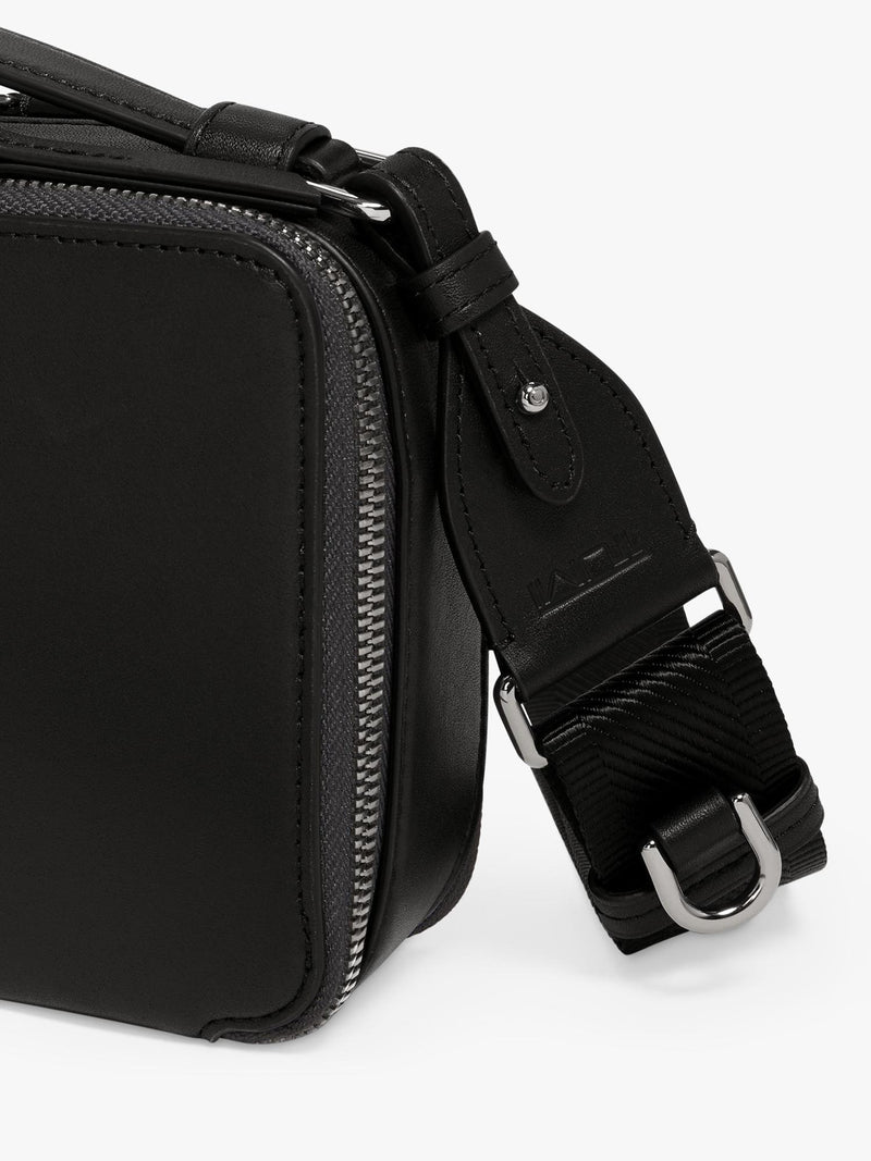 TUMI Myla leather crossbody bag in black gunmetal (British brand)