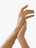 Orelia Organic Molten Bangle in Pale Gold, UK version
