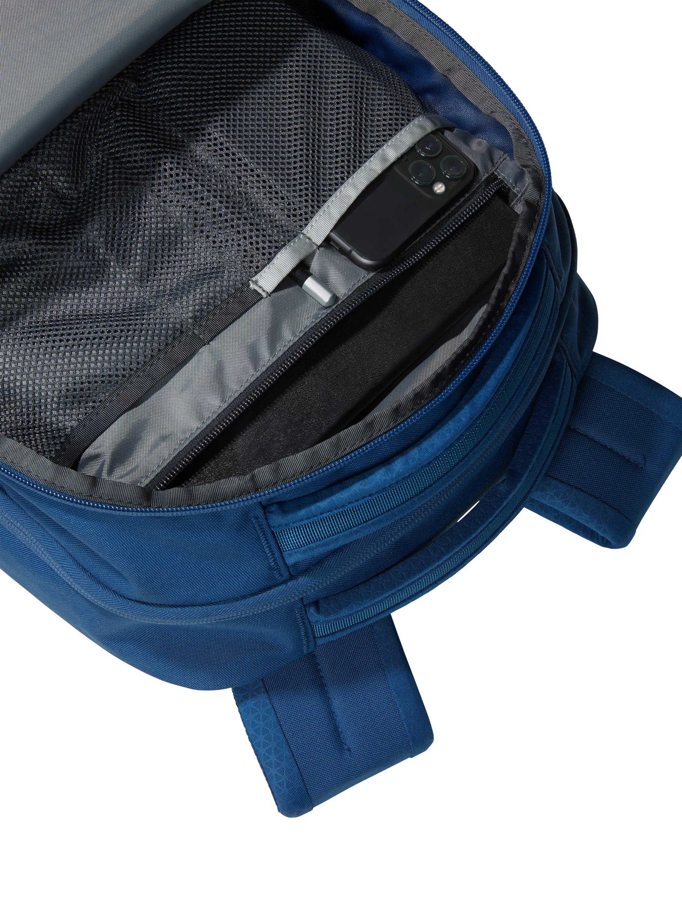 The North Face Vault backpack in blue and white, imported from the UK