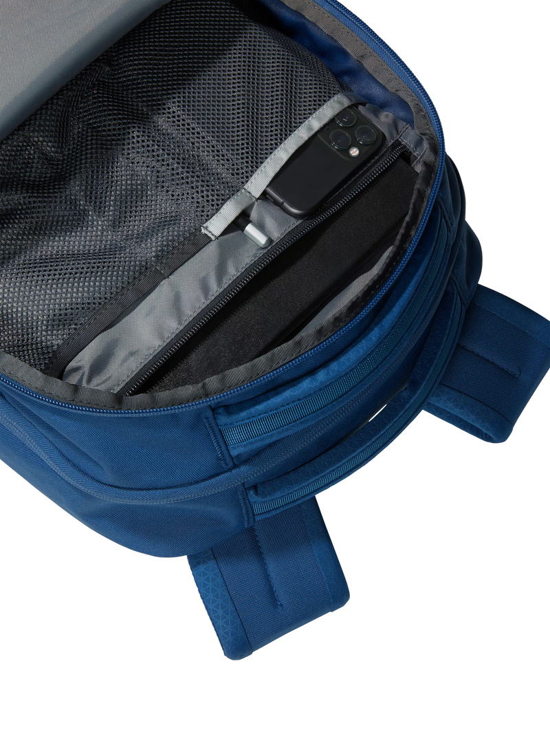 The North Face Vault backpack in blue and white, imported from the UK
