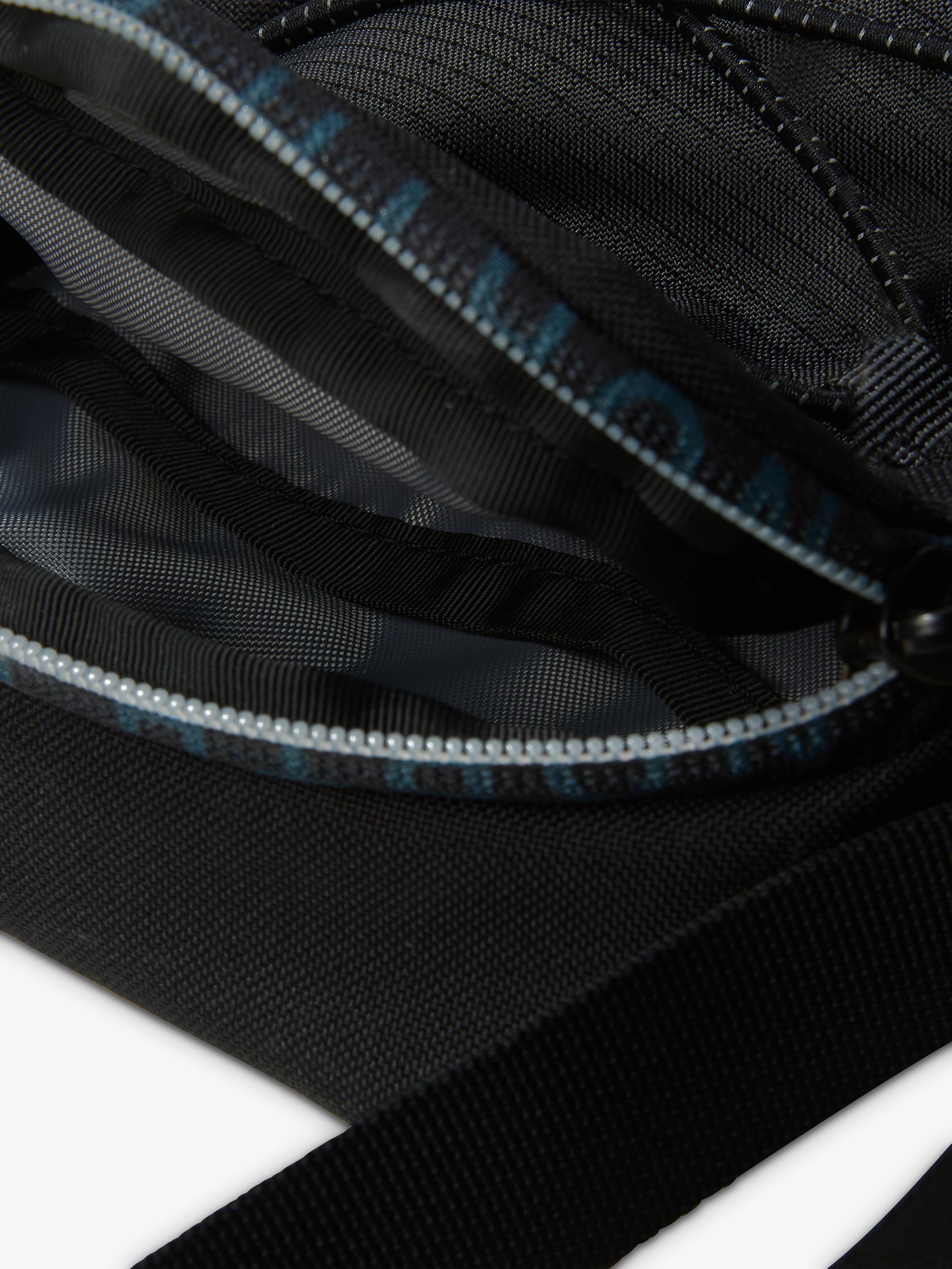 The North Face Jester cross body bag in asphalt grey and black, UK version