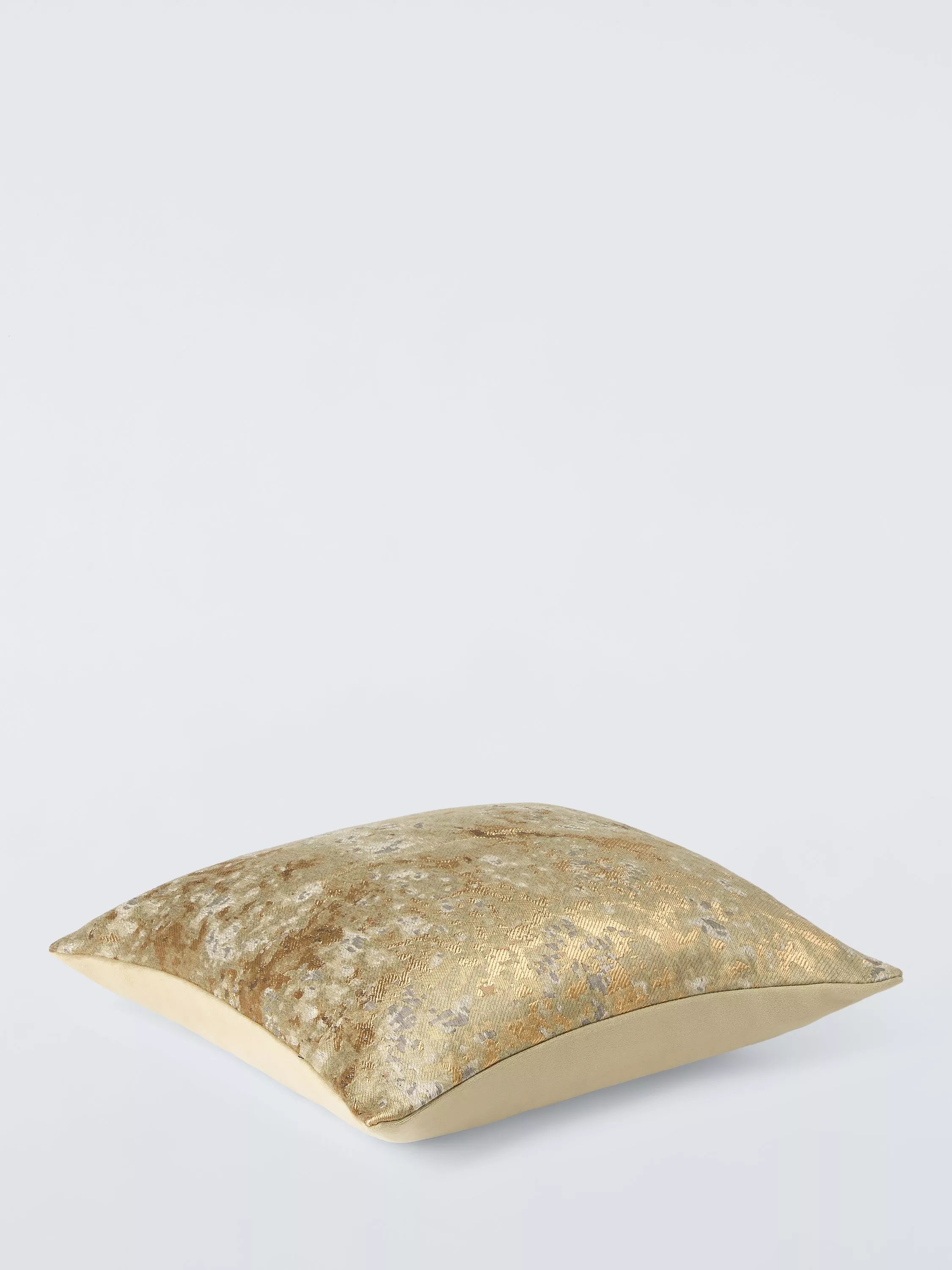 Harlequin Aconite cushion with dappled design and metallic highlights, UK version
