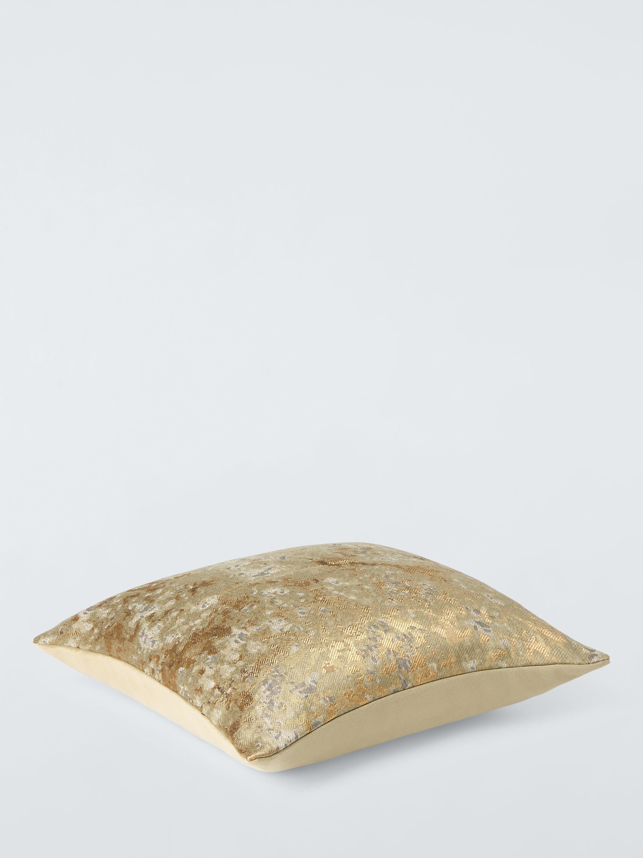 Harlequin Aconite cushion with dappled design and metallic highlights, UK version