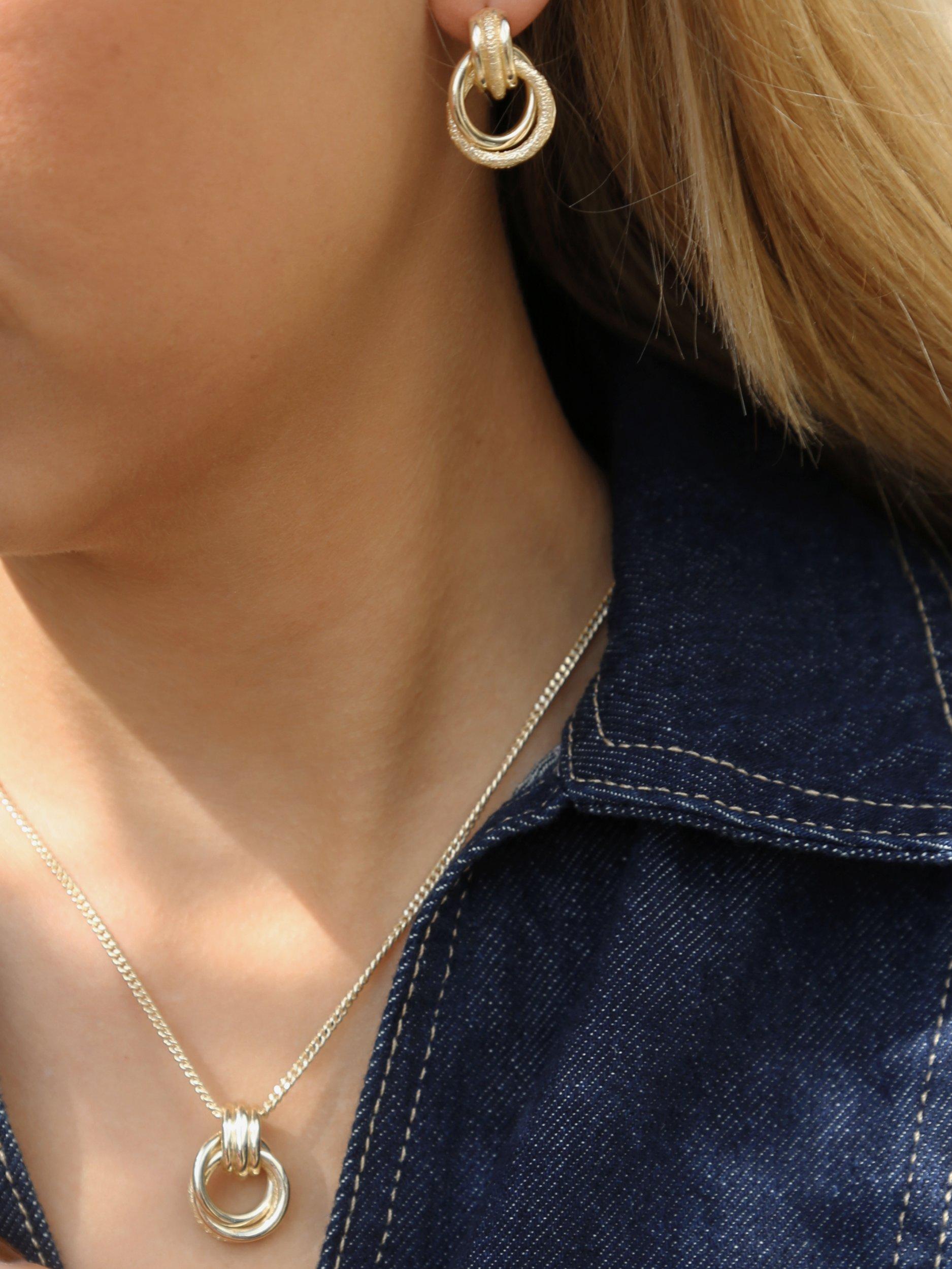 Tutti Fuse interlocking drop earrings in gold, imported from the UK