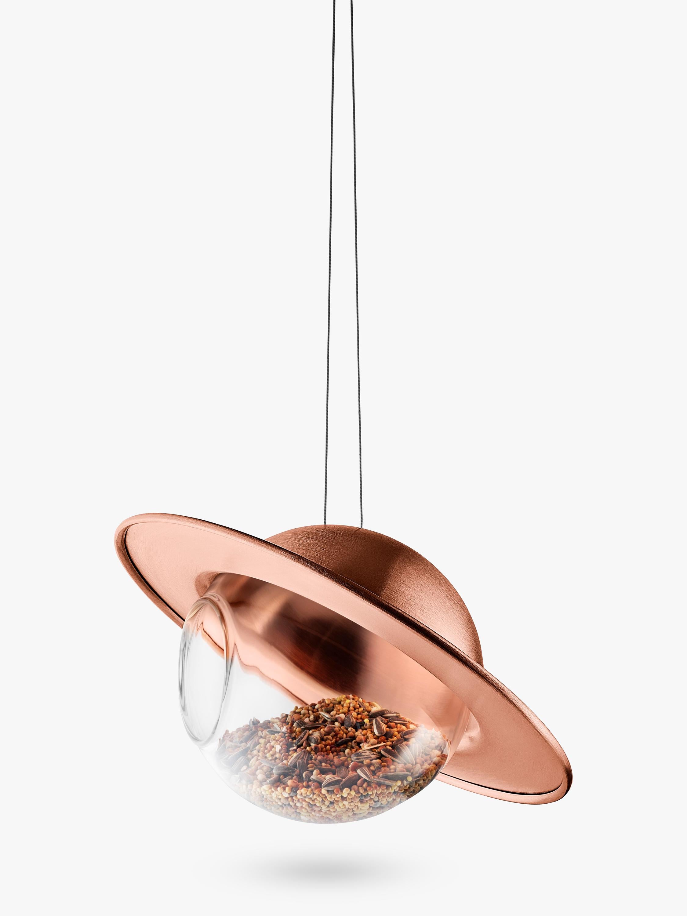 Eva Solo Saturn bird feeder with copper canopy and glass orb, imported from the UK