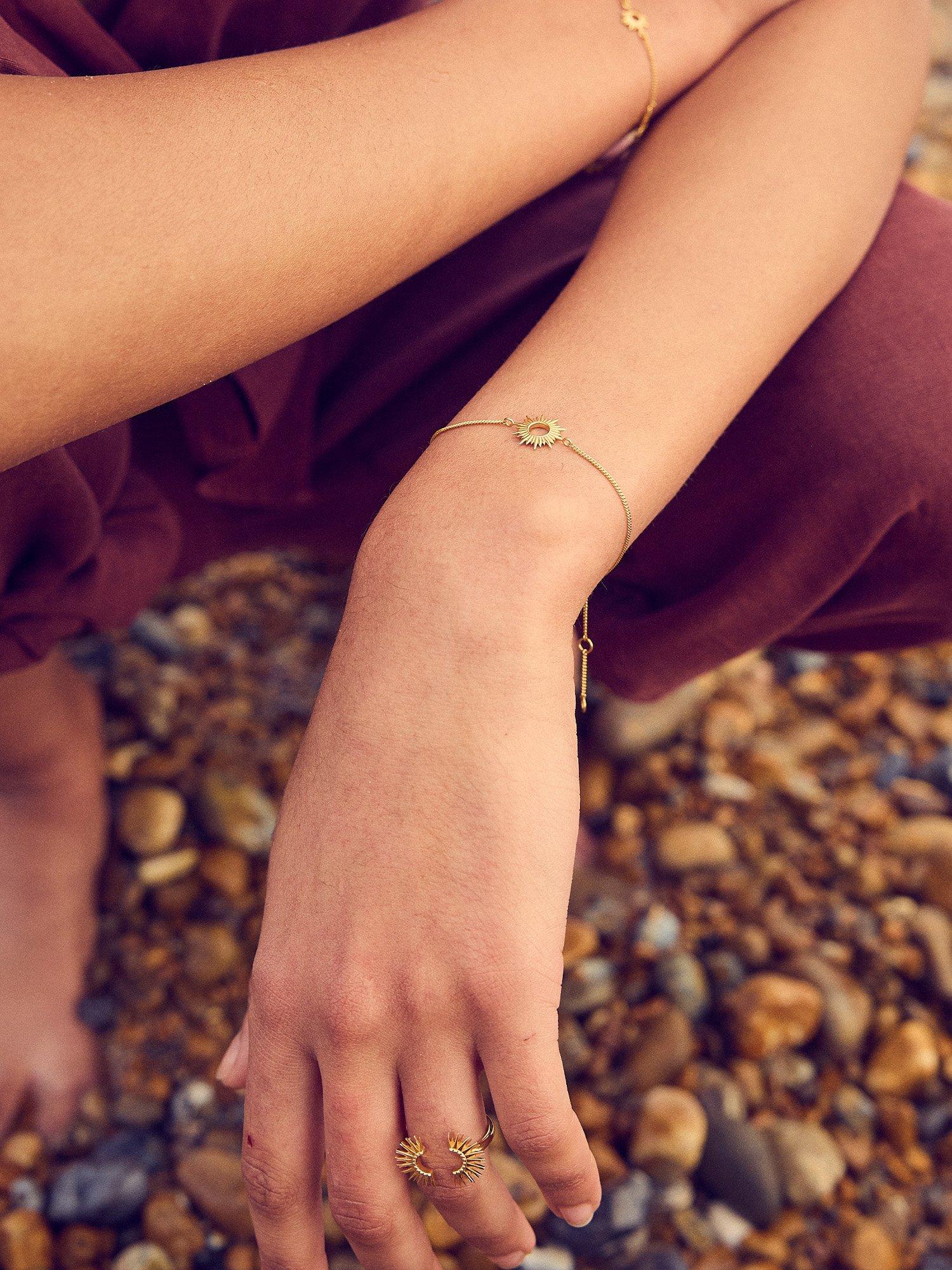 Rachel Jackson London gold chain bracelet with sun motif, imported from the UK