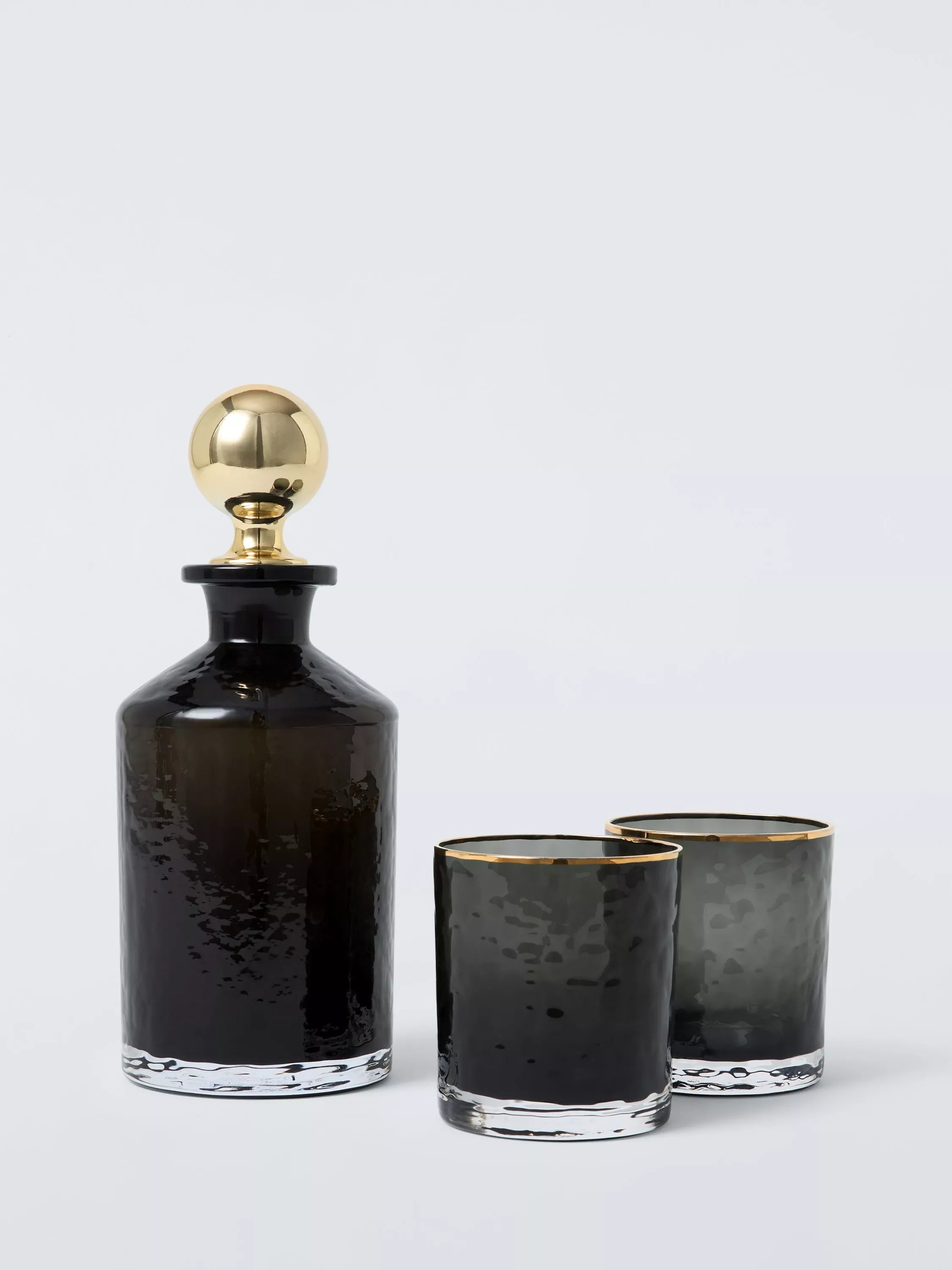 John Lewis black glass decanter and tumbler gift set with gold accents, imported from the UK