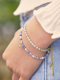 Estella Bartlett bee charm bead bracelet in blue and gold, UK version