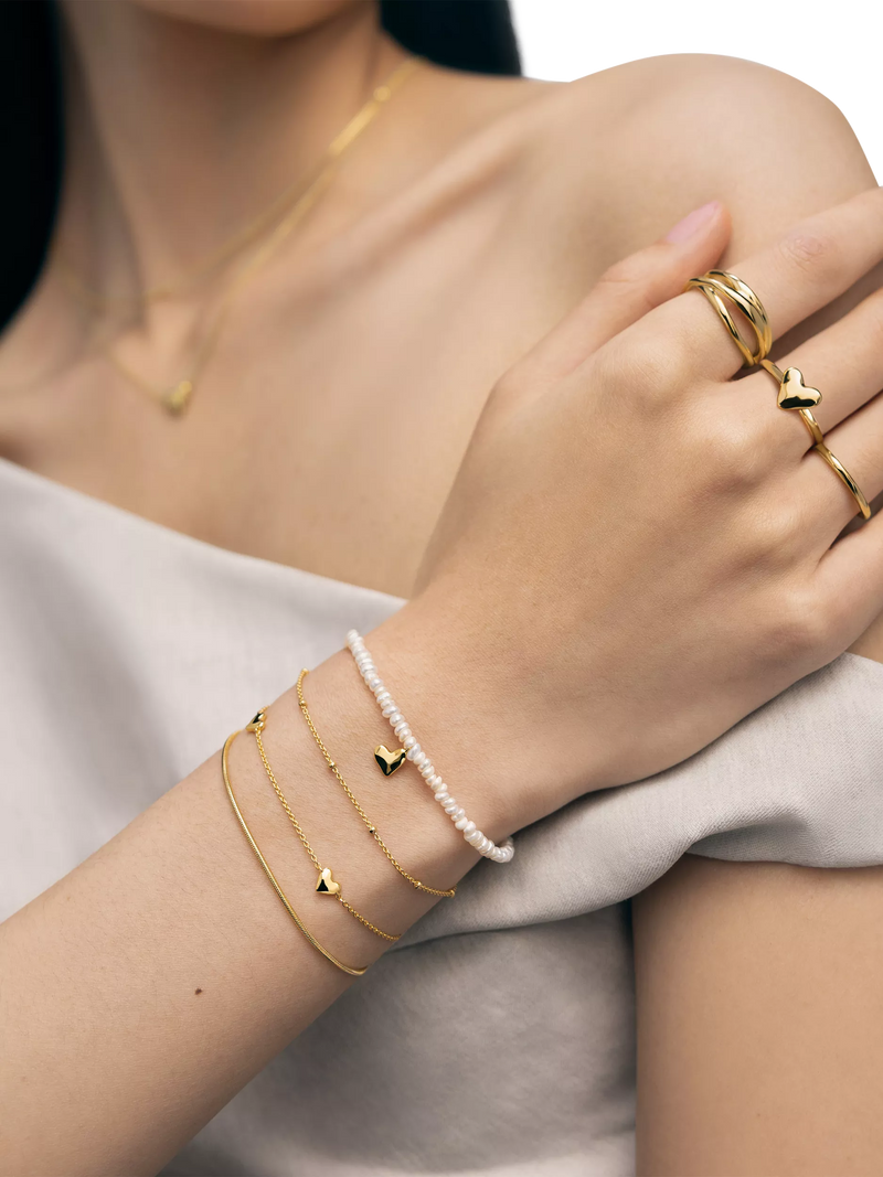 Monica Vinader Mini Heart Pearl Bracelet Gold, imported from the UK