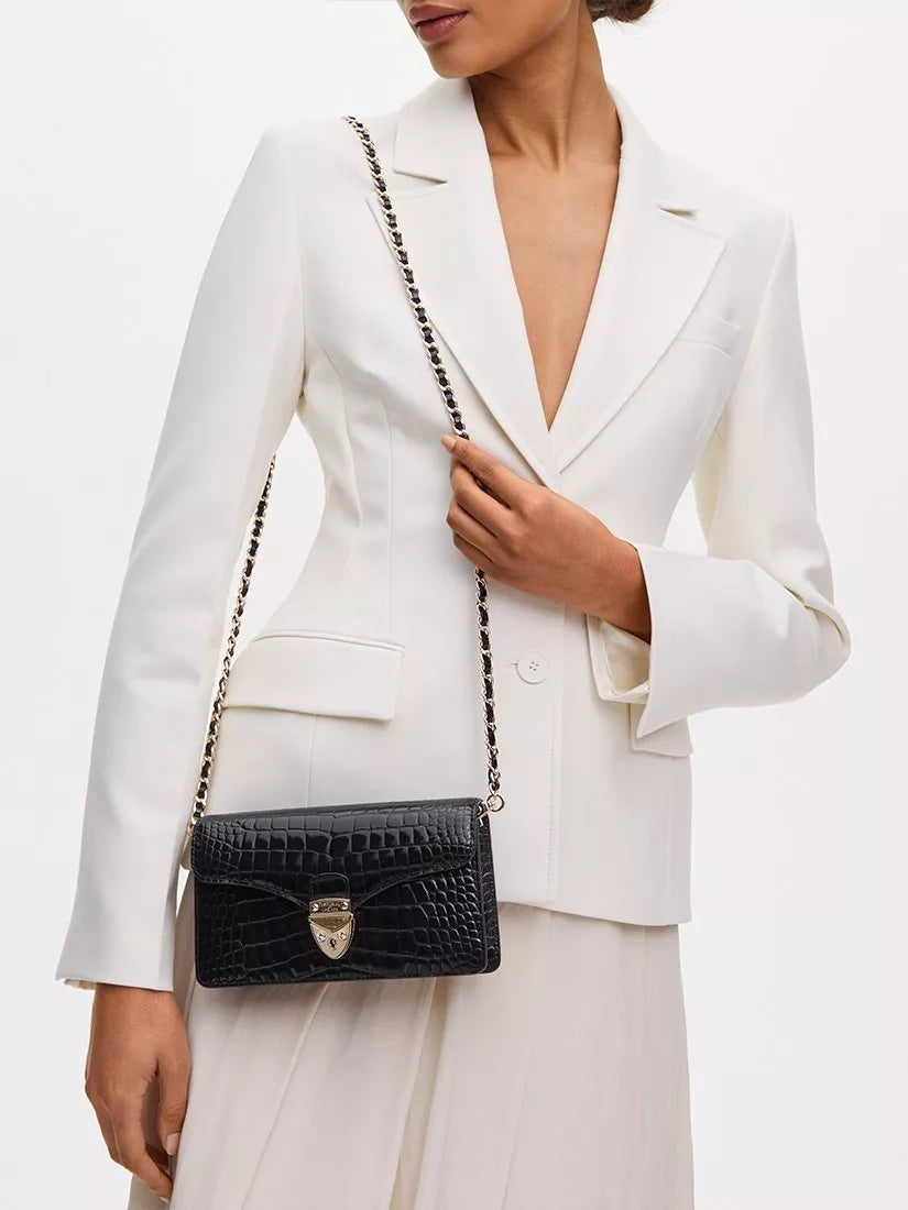 Aspinal of London patent croc clutch bag in black, imported from the UK