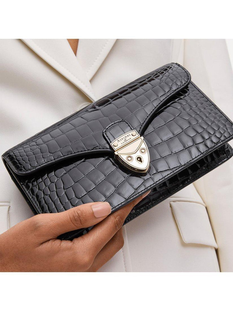 Aspinal of London patent croc clutch bag in black, imported from the UK