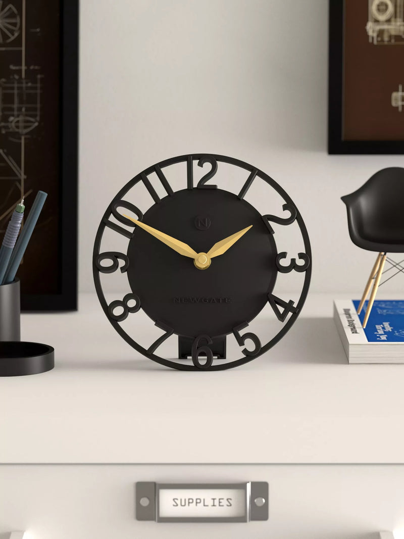 Newgate Timewarp mantel clock in black with gold-tone hands (British brand)