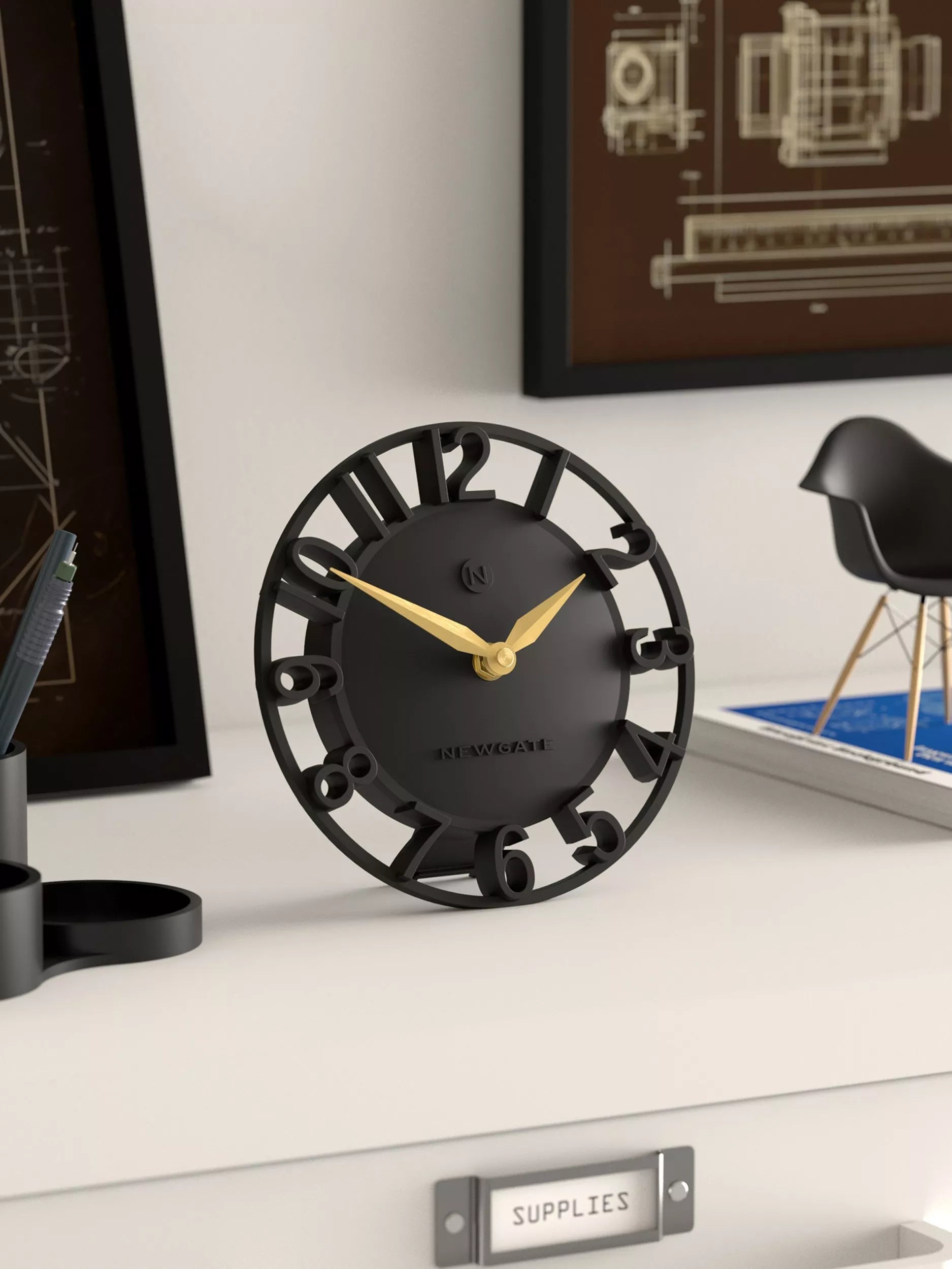 Newgate Timewarp mantel clock in black with gold-tone hands (British brand)