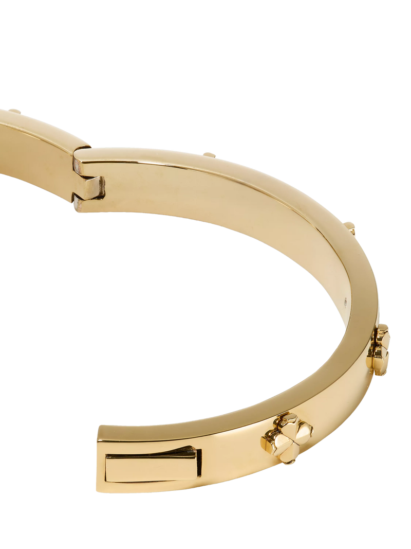 kate spade new york hinged flower bangle gold plated, imported from the UK