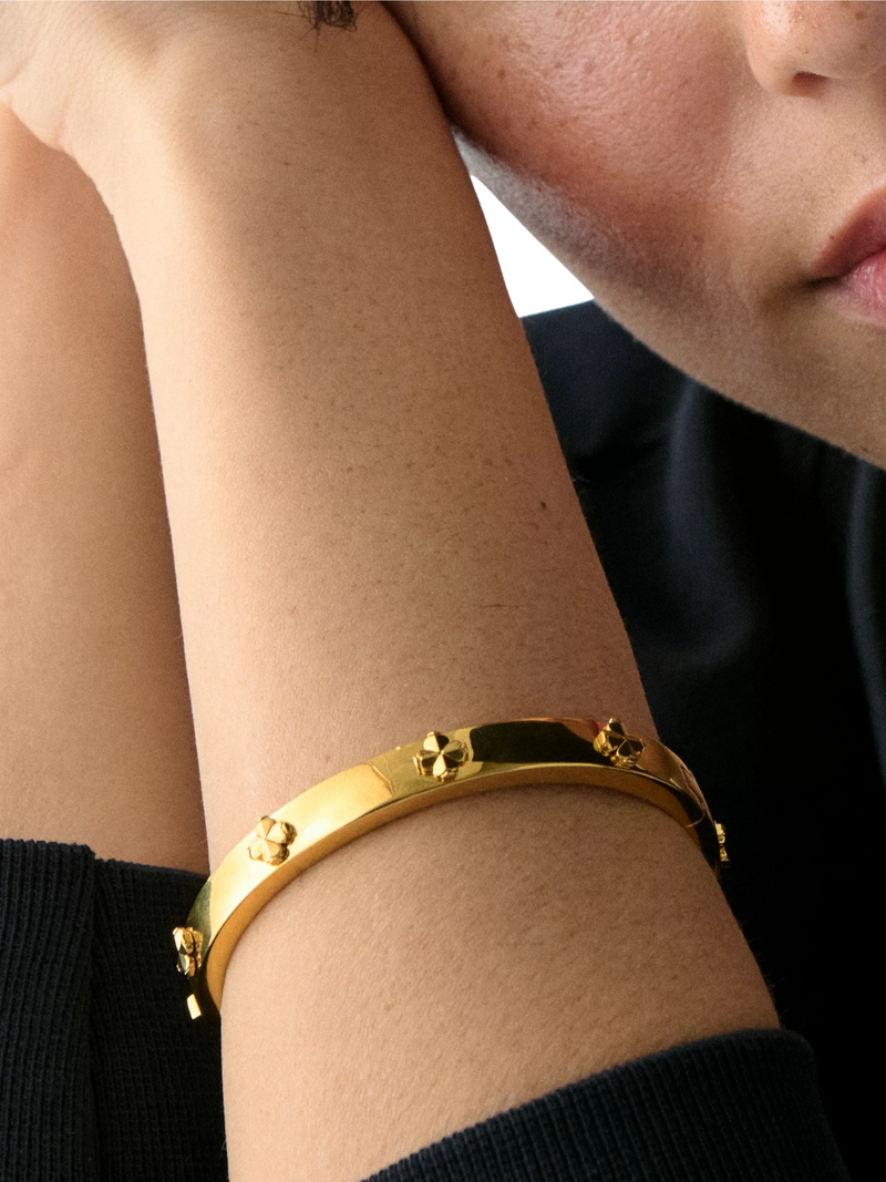 kate spade new york hinged flower bangle gold plated, imported from the UK