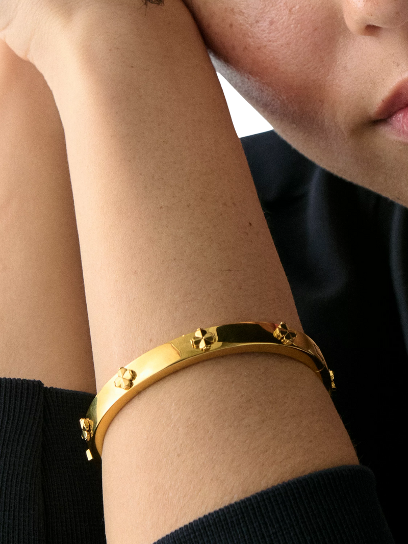 kate spade new york hinged flower bangle gold plated, imported from the UK